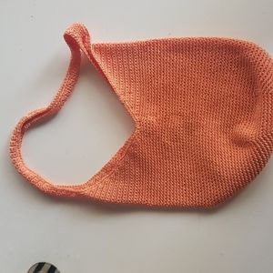 The Sak knit hobo bag in orange.